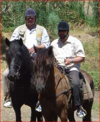 Riding horse with vine-journalist Radek John, Rhebokskloof vineyard, 2009