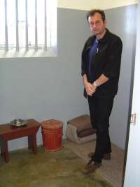 In the prison cell of Nelson Mandela at the Robben Island